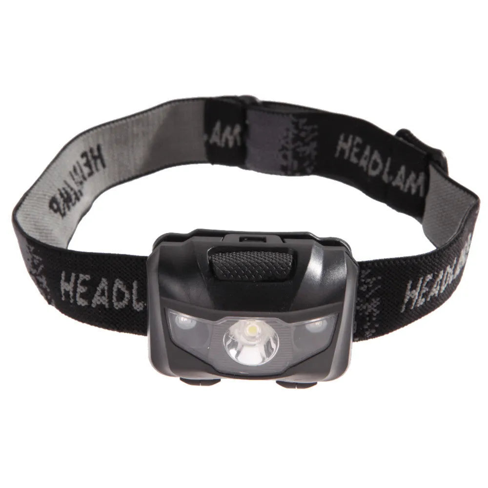 Black head torch with white and red LEDs mounted on adjustable headband for outdoor use