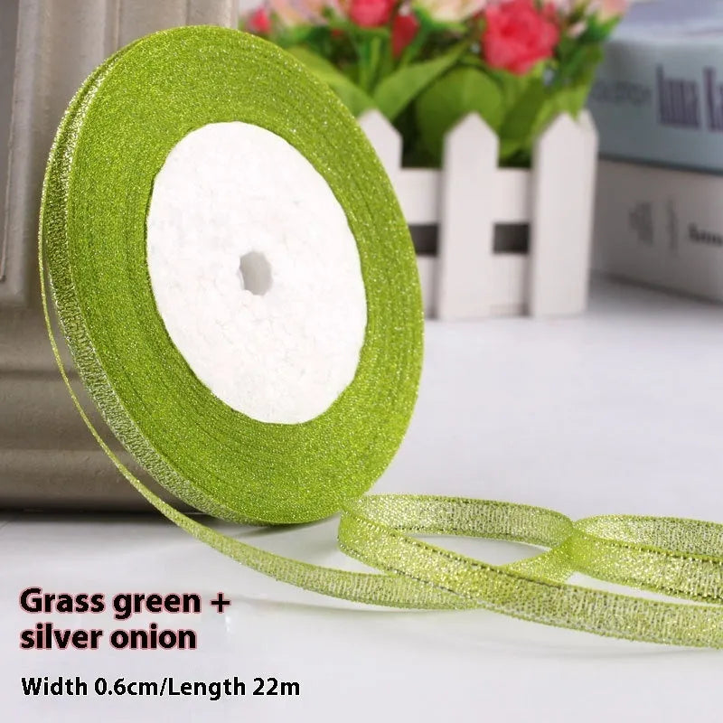 Roll of narrow 0.6cm wide polyester gift wrapping ribbon in assorted colours, showing 22 metre length.