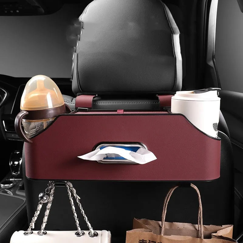 Genuine leather car tissue box and cup holder organiser in black, suspended from a headrest.