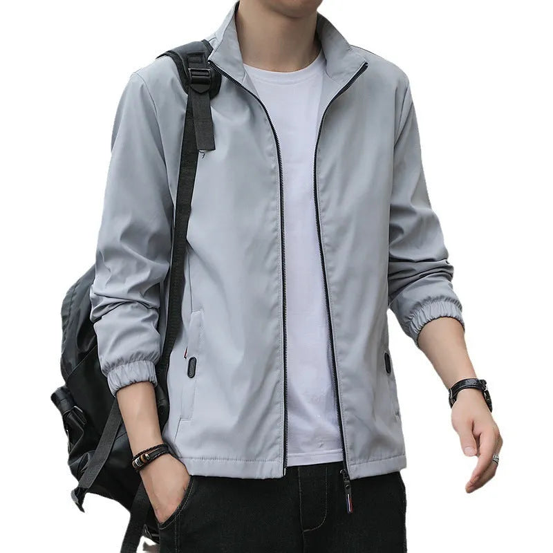 Korean-style men's loose lapel autumn jacket in a casual blue colour with zippered pockets.