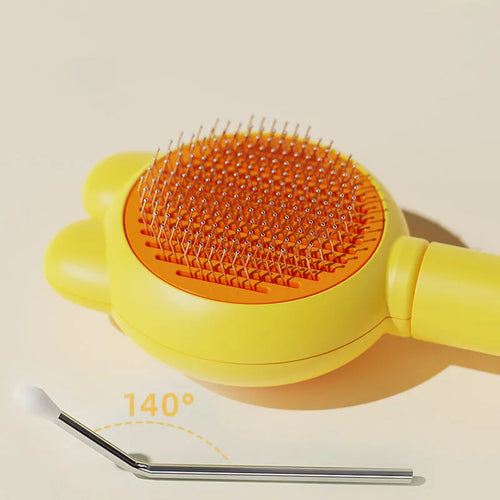 Green self-cleaning pet grooming brush with a stainless steel comb and a comfort-grip handle.