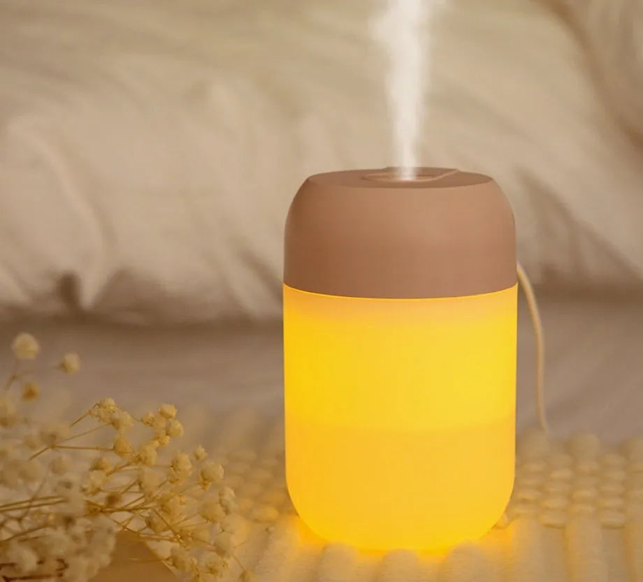 White cylindrical USB-powered humidifier with aromatherapy function on desk