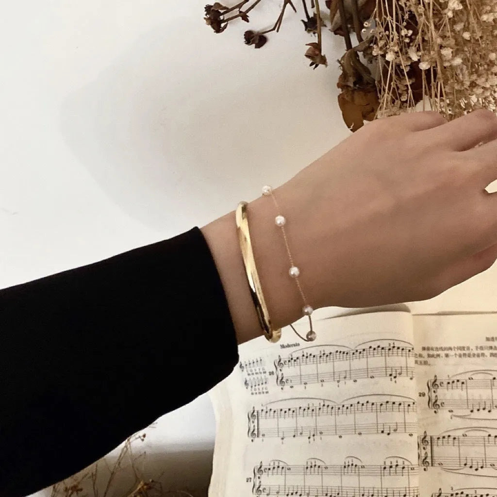 Double layered pearl coloured electroplating alloy bracelet, Korean style geometric design for women