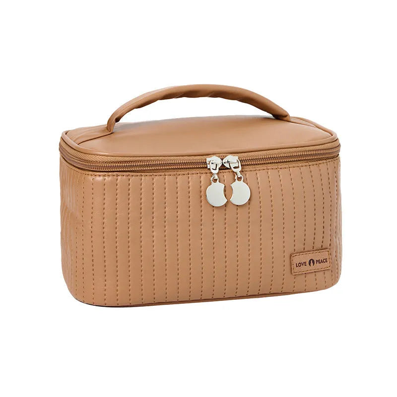 Open-top cake-shaped makeup bag in PU leather, shown in a solid colour from the pink, coffee, beige, blue, green, purple range.