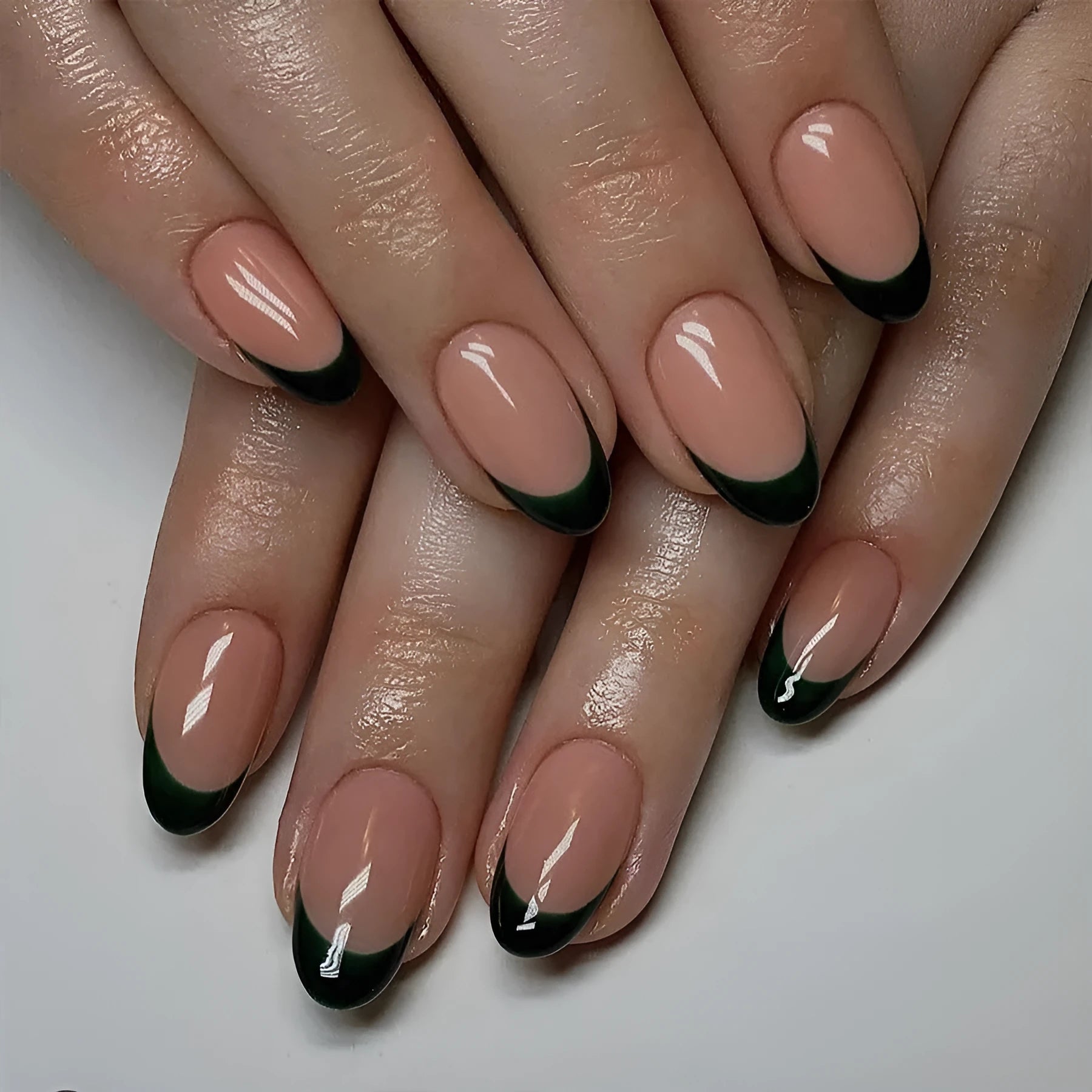 Set of 24 black French style false nails in a short almond shape