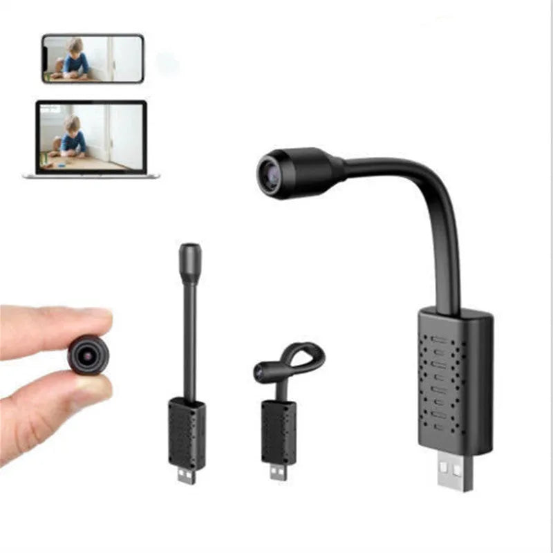 Black V380 wireless USB security camera on a table next to a mobile power bank.
