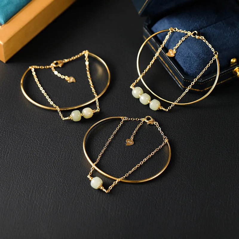 Women's Hetian jade lucky beads bracelet with gold inlay in single, double, and three-bead versions.