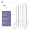 Four metal acne needles with pointed tips arranged on a clean surface.
