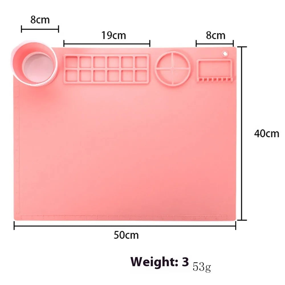 Light blue silicone painting mat with two round bowl compartments, measuring 50 by 40 cm.