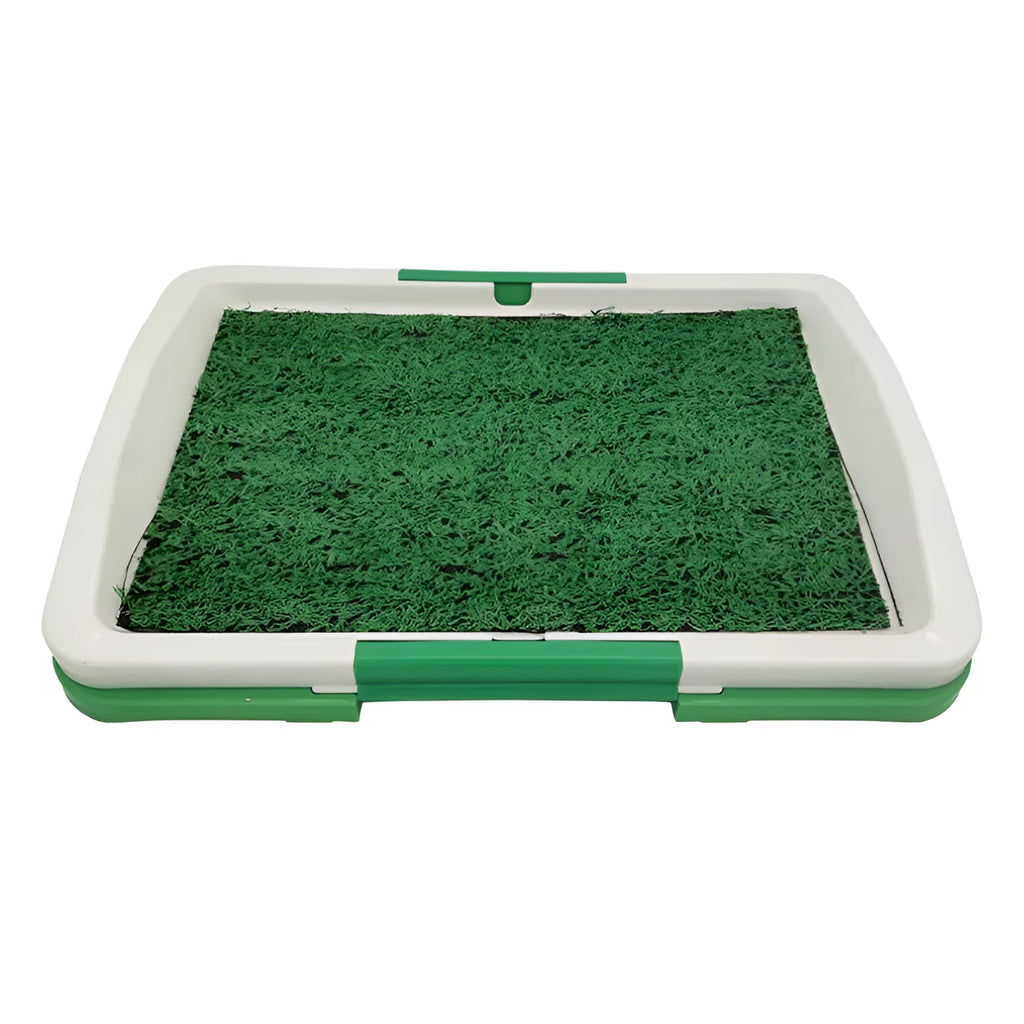 Green synthetic turf dog toilet trainer with three-layer plastic tray system for indoor use.
