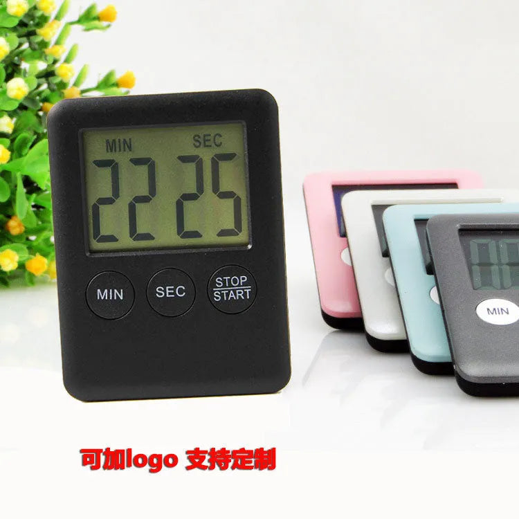 Black and white kitchen timer with magnetic back showing count-up and countdown display