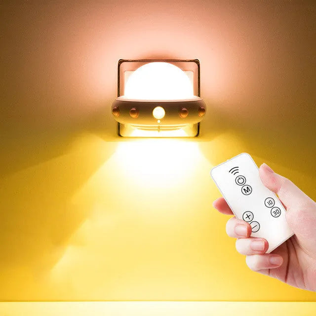 Blue remote control UFO shaped bedside night light with dimensions 105mm by 76mm by 58mm