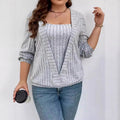 Women's solid colour ribbed V-neck false two-piece suit top with long sleeves on a hanger.