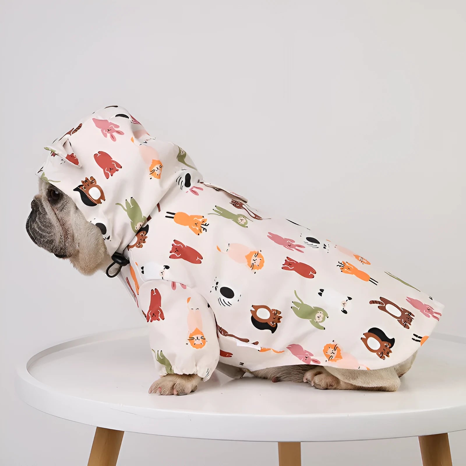 Beige cartoon dog raincoat with animal design and waterproof coating for wet weather protection