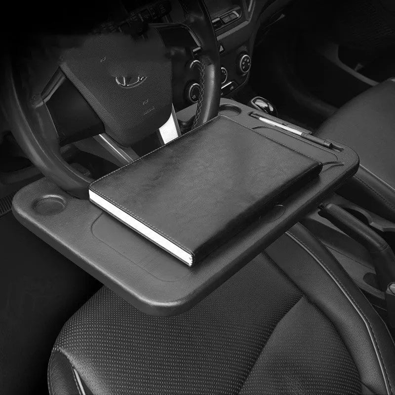 Black plastic car tray desk measuring 42cm by 28cm on a car seat
