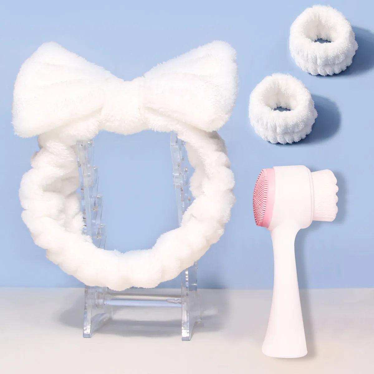 Facial brush set with coral fleece hair band, absorbent headband, and waterproof shower brush in purple colour