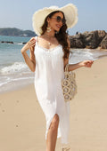 White suspender beach dress with woven crochet detail and a bottom slit, laid flat.