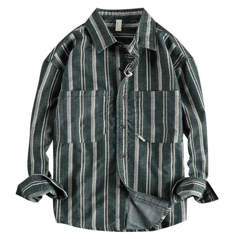 Man wearing a vintage-style striped overalls shirt in apricot colour with long sleeves and loose fit.