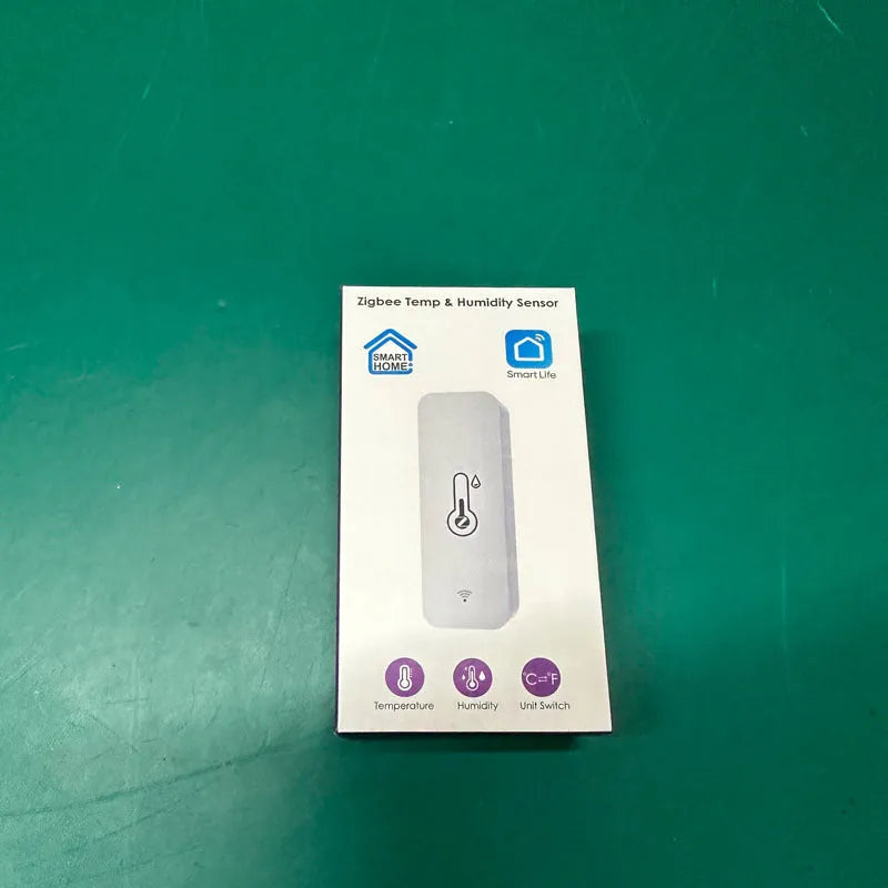 Compact white ABS plastic WiFi Zigbee temperature and humidity sensor for Tuya smart homes.