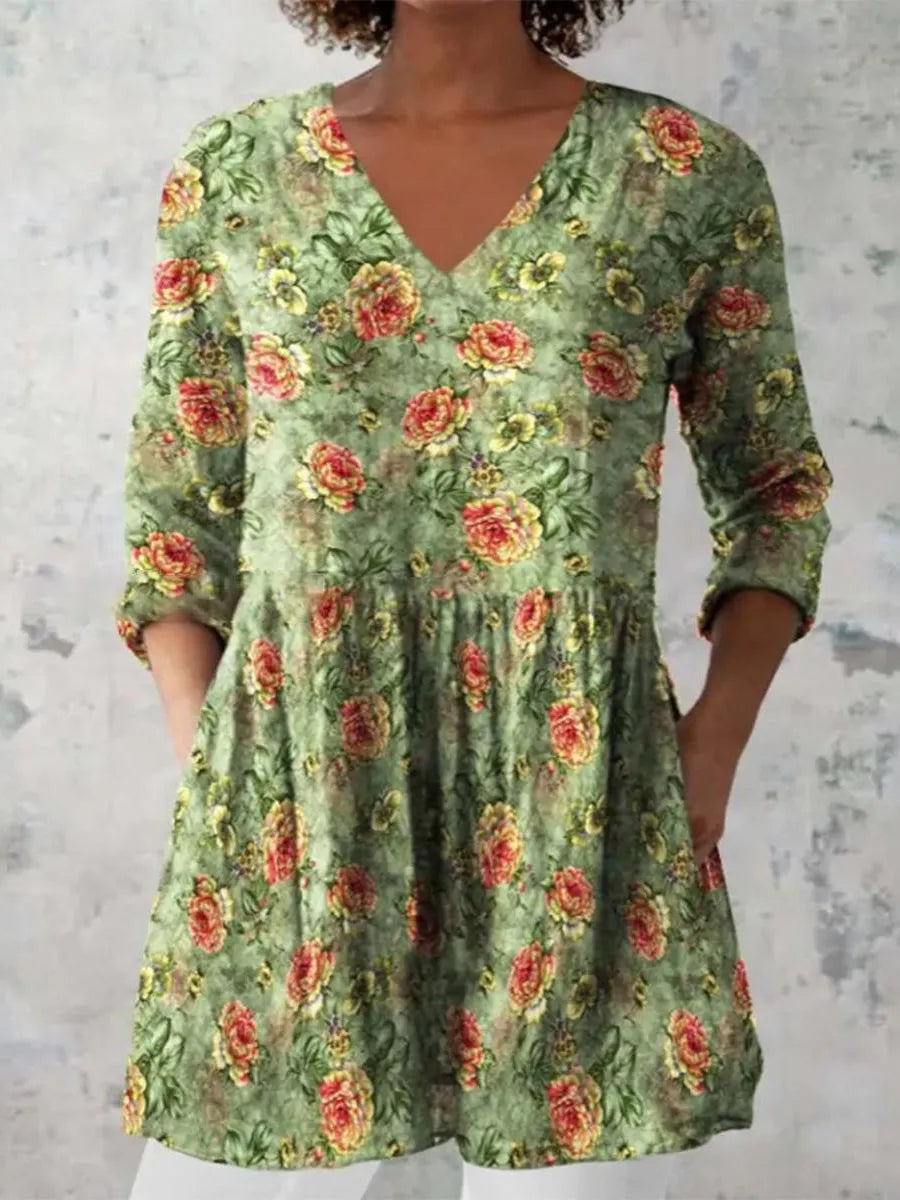 Women's printed loose wave dress with wide waist and three-quarter sleeves in a floral pattern.