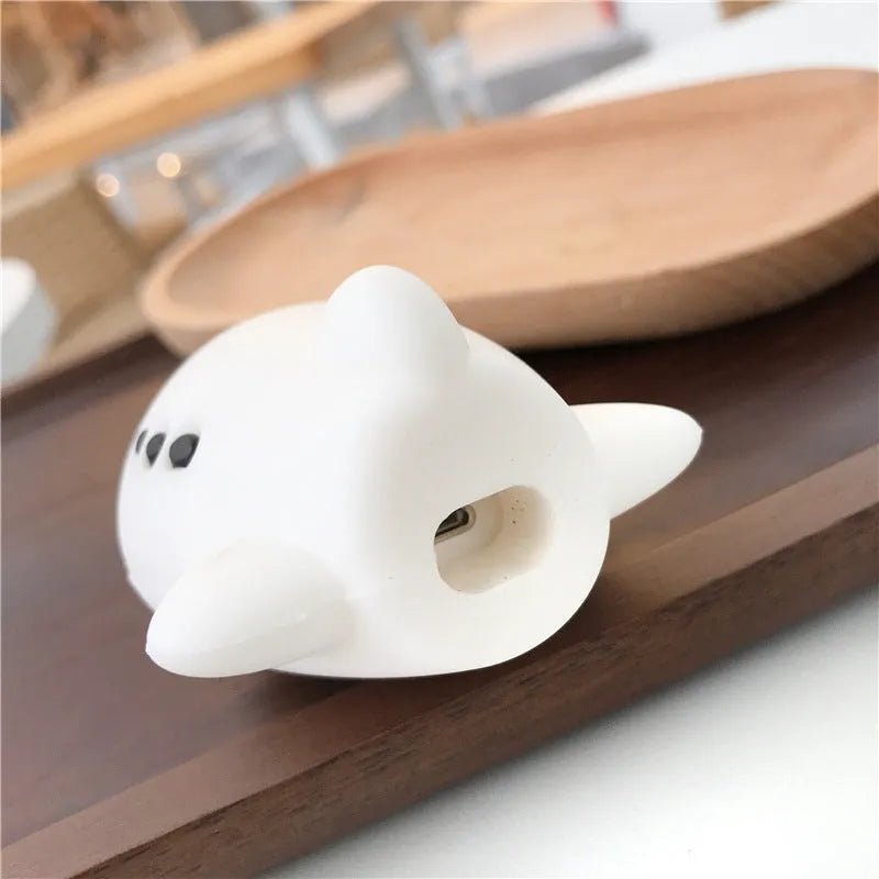 Silicone AirPods protective case with flip-top design, cartoon airplane graphics, and integrated carrying hook