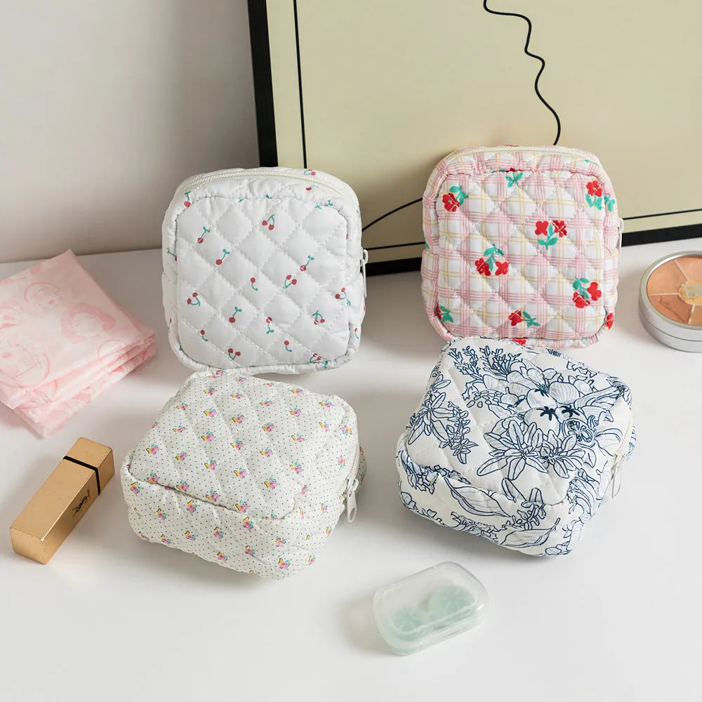 Breathable polyester key storage bag showing multiple floral and cherry pattern options including white background designs