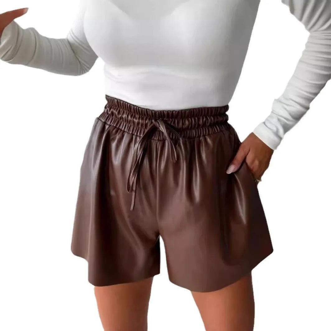 Women's black wide-leg shorts with a front lace-up drawstring waist detail.