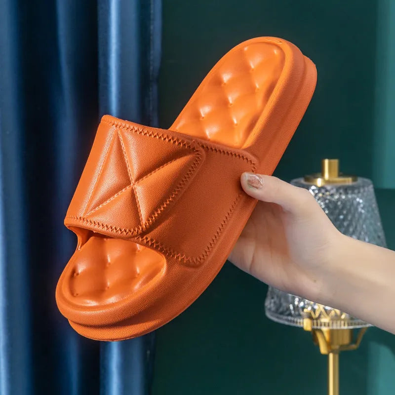 A pair of thick-soled EVA bathroom slippers in a selected colour, showing the non-slip sole pattern.