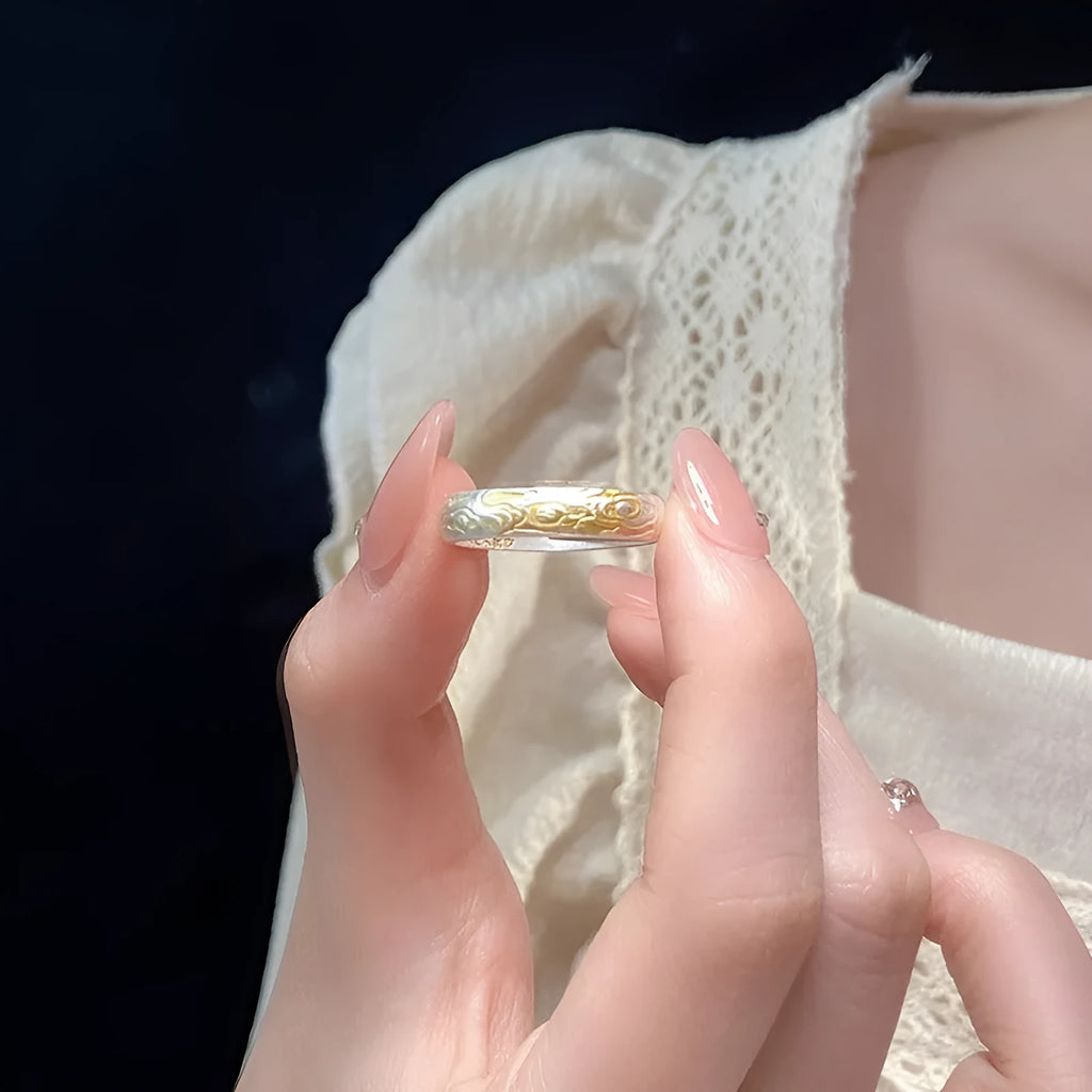 Geometric Xiangyun pattern open-mouth ring with silver and gold electroplated finish on white copper.