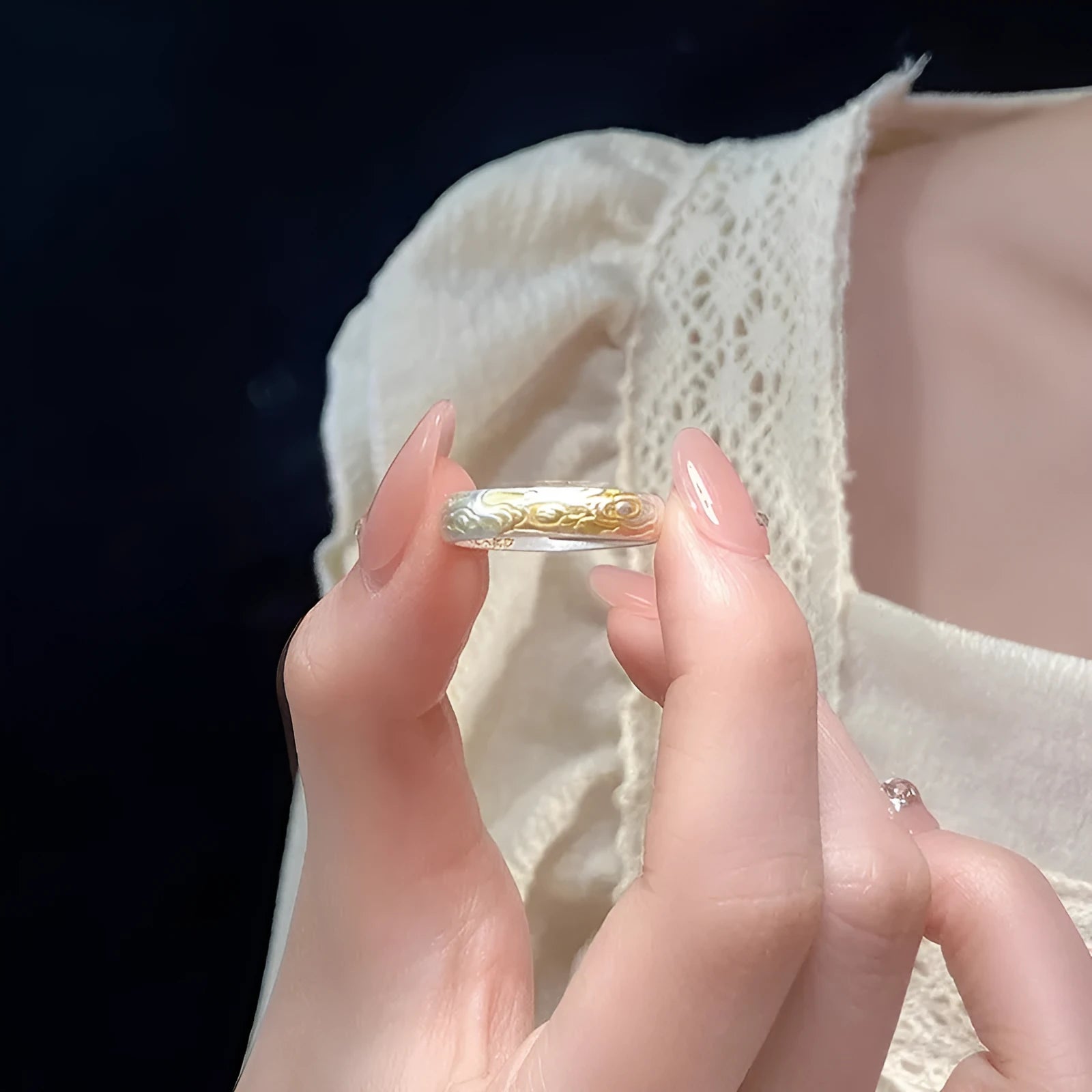 Geometric Xiangyun pattern open-mouth ring with silver and gold electroplated finish on white copper.