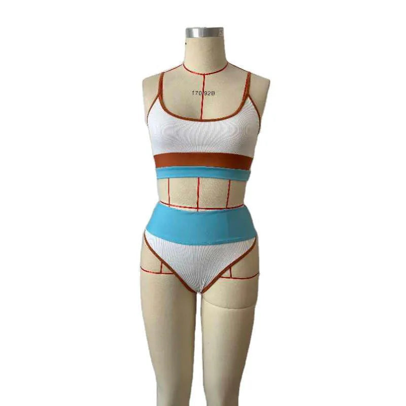 Women's solid colour quick-dry bikini swim set with top and shorts.