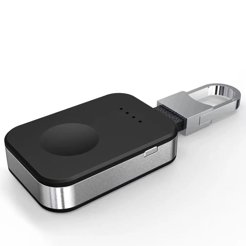 Black Apple Watch keychain wireless power bank with 1000mAh battery next to an Apple Watch.