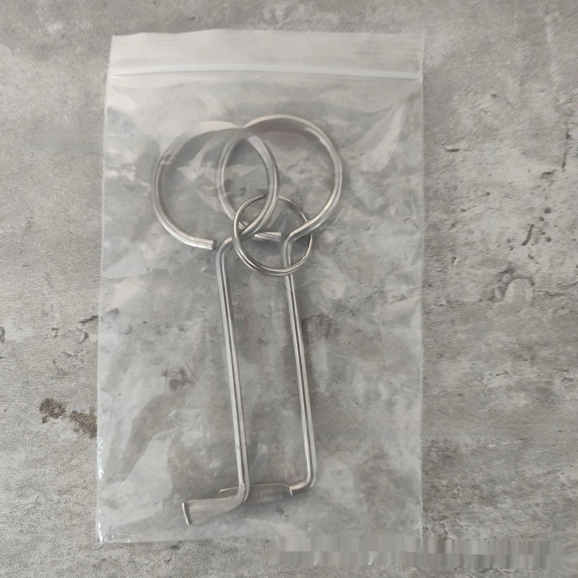 Two alloy wrench tools from a portable universal family toolkit set on a white background.