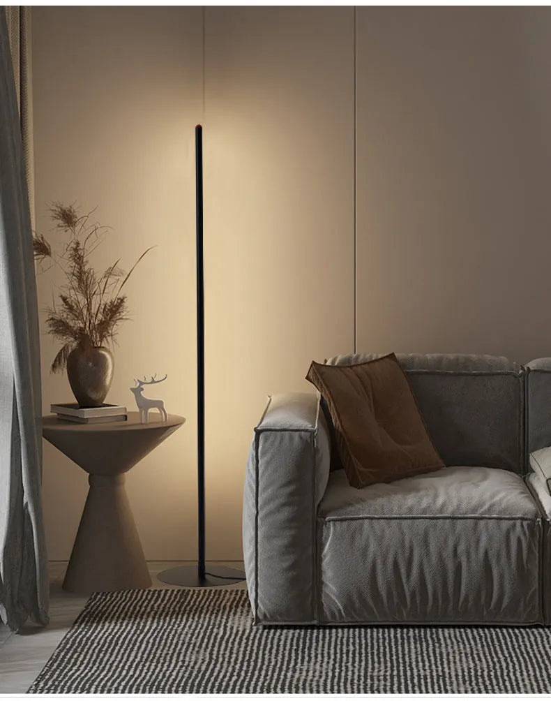 A tall, vertical aluminium alloy floor lamp with a modern design on a simple base.