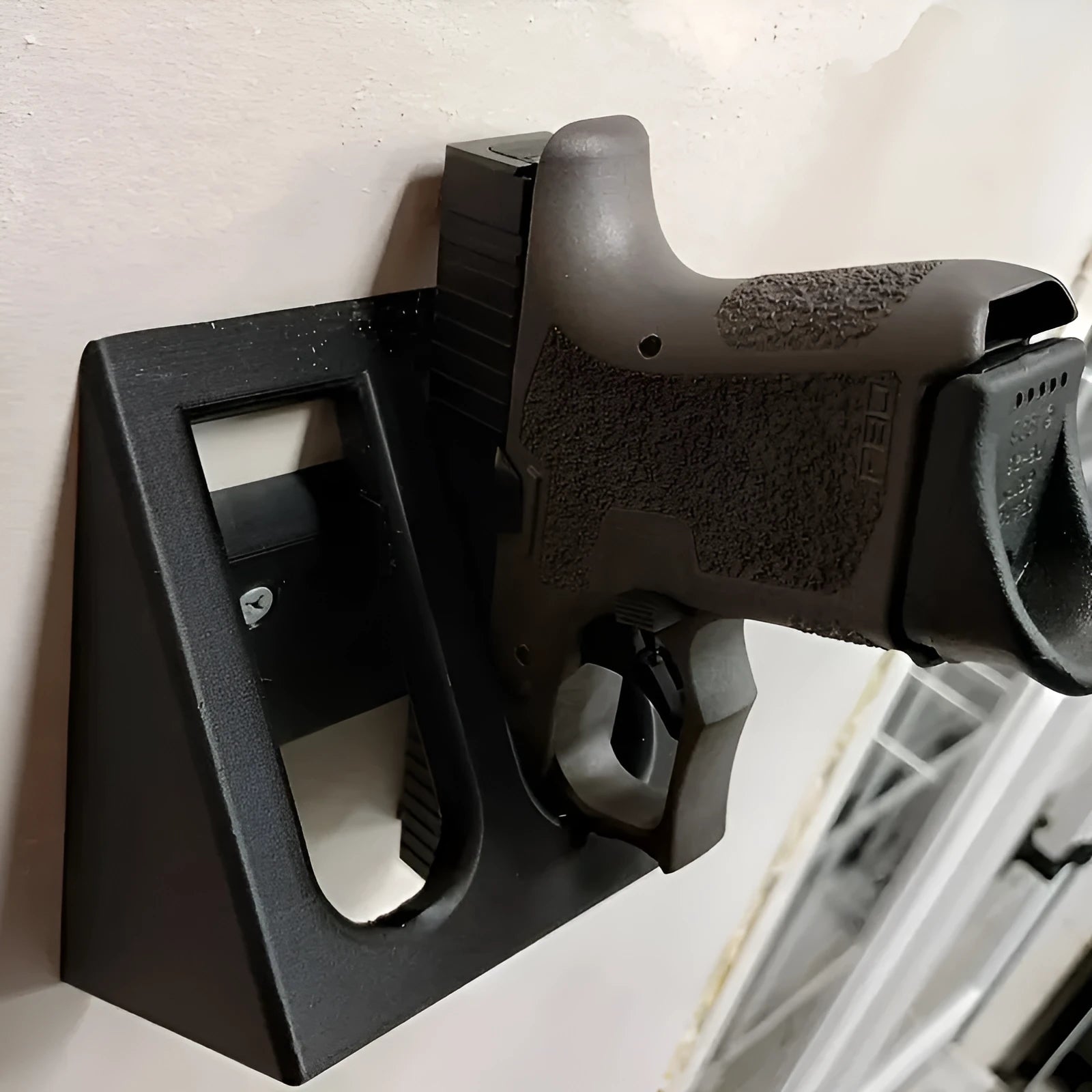 Black plastic pistol stand for 0 scale replica firearms with punk-style design