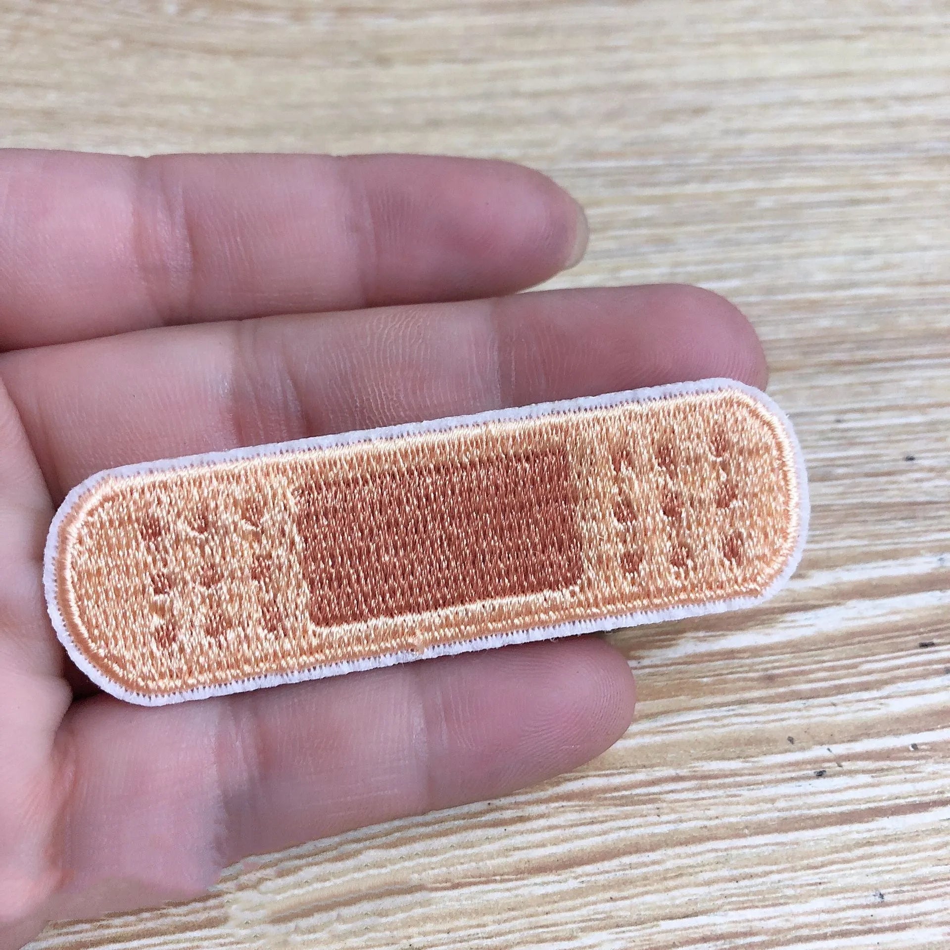 Ten embroidered cloth patches with lace edges for clothing decoration on fabric background