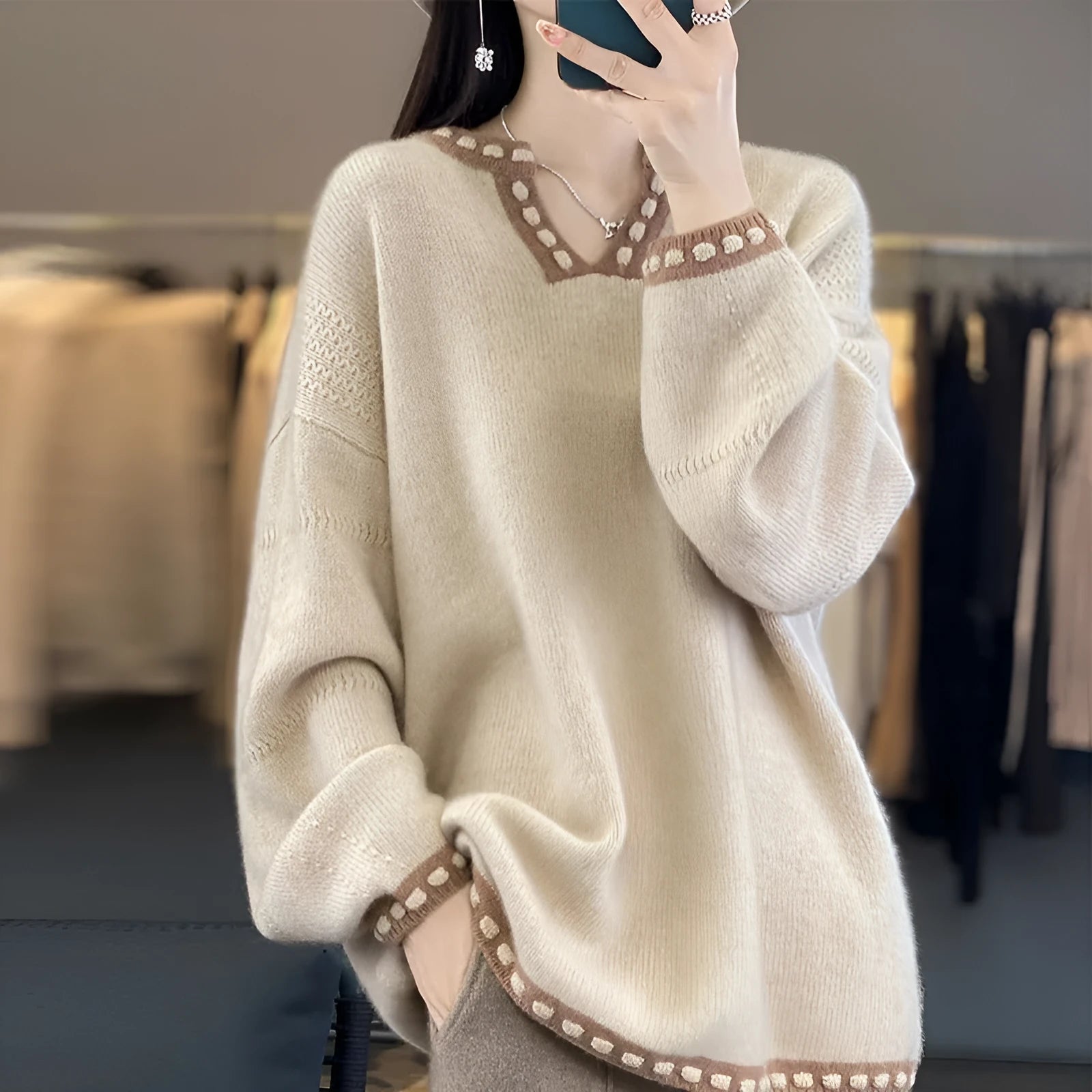 Women's camel and white V-neck viscose sweater with long sleeves showing pullover design