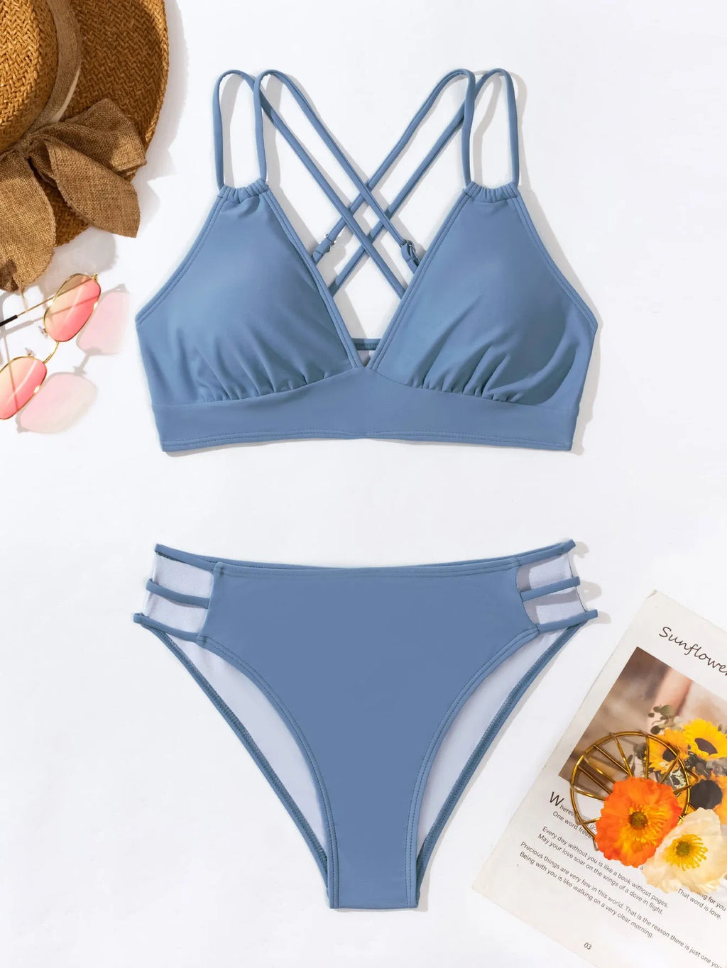 Women's black halter neck bikini swimsuit with V-neck top and split shorts on mannequin