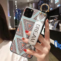 Rose floral patterned phone case with a wrist strap attachment point for iPhone.