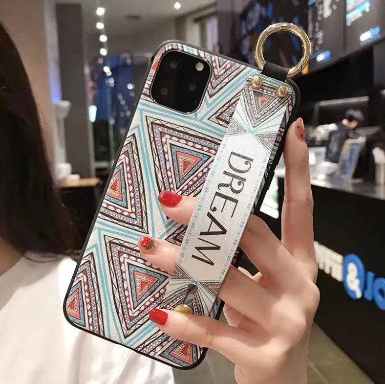 Rose floral patterned phone case with a wrist strap attachment point for iPhone.