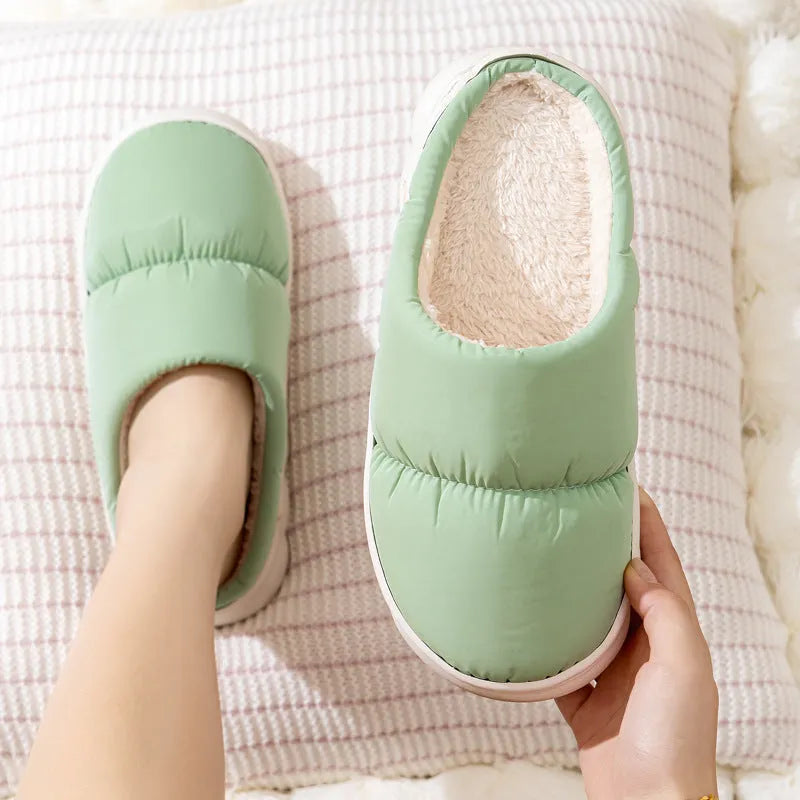 Blue winter slippers with artificial leather upper and thick rubber sole, showing plush lining.