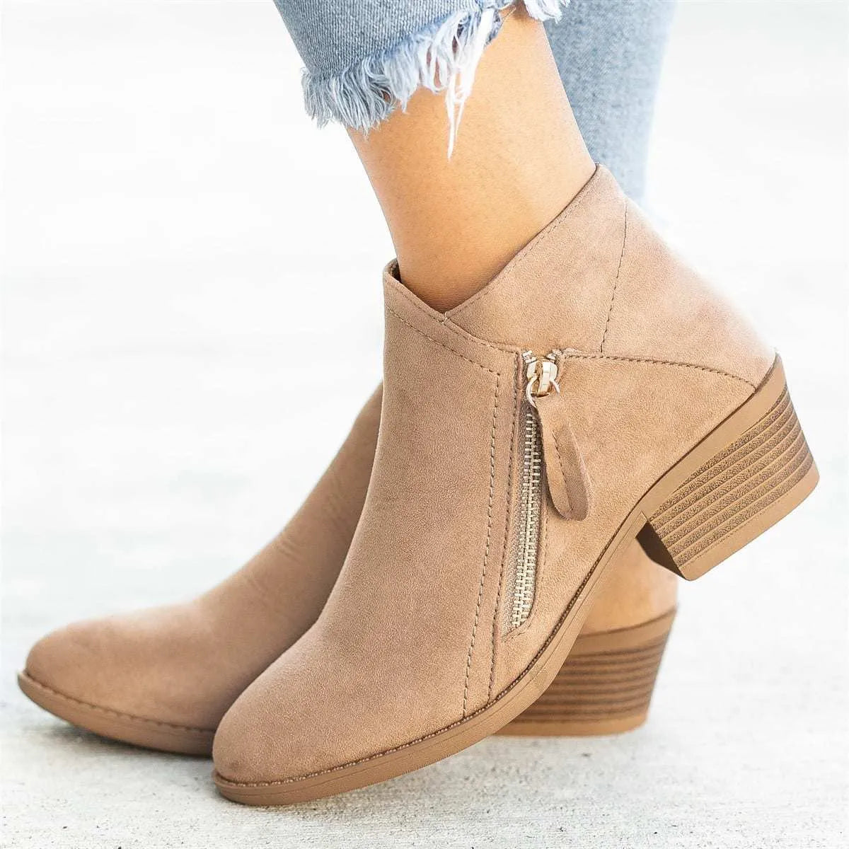 Women's suede ankle boot with side zip, chunky heel, in beige, black, blue, or orange.