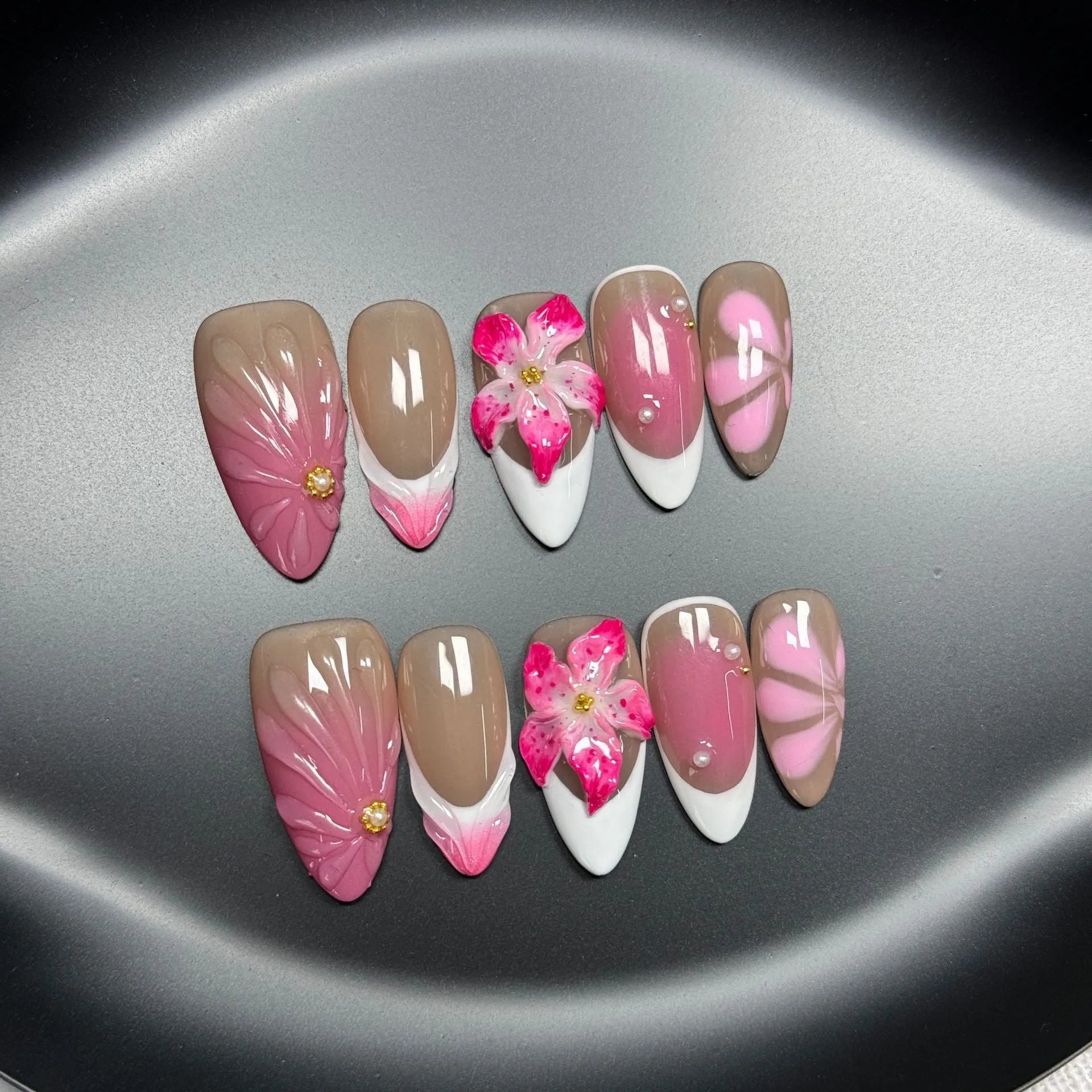 French style three-dimensional lily ice flower gel nail stickers in almond shape on plastic backing.
