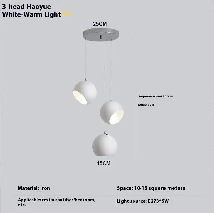 Post-modern ball chandelier table lamp in Moon White or Obsidian Black finish, available in single-head or three-head configurations.
