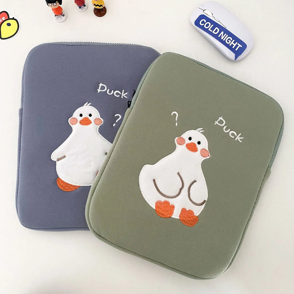 Blue cotton tablet case with embroidered cartoon duck design and a zipper.
