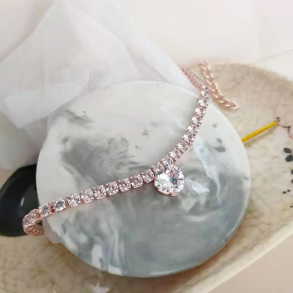 Gold rhinestone heart design pet collar for cats and dogs on a white background.