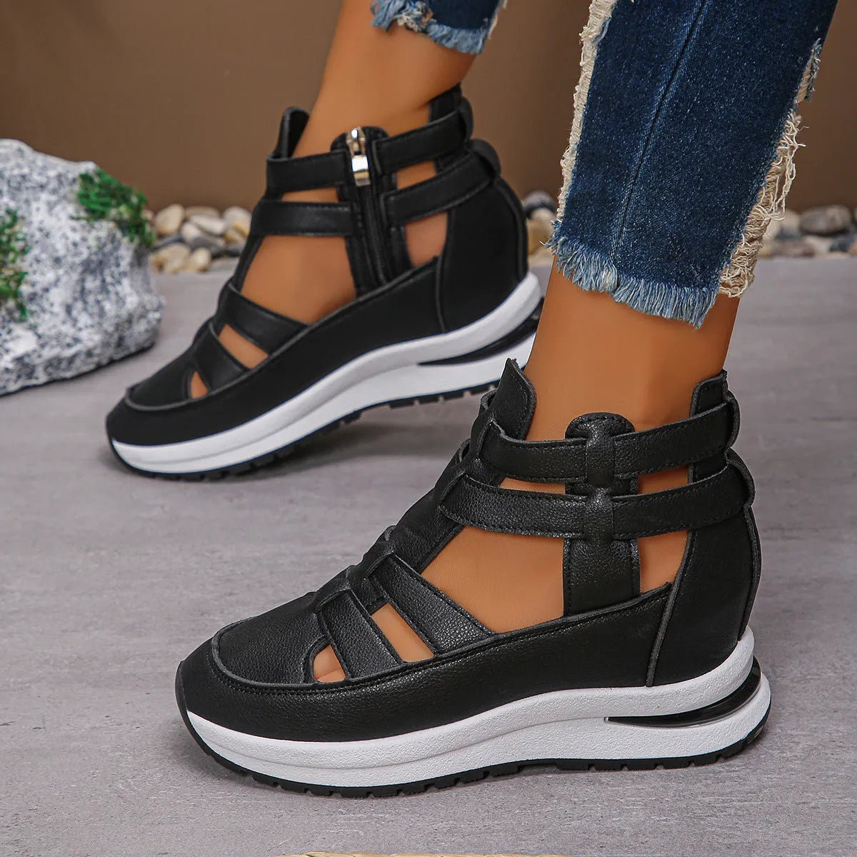 Women's black close-toed platform sandals with Velcro strap and hollow-out design.