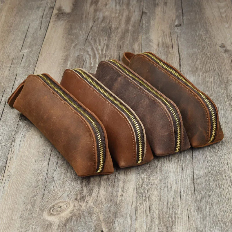 Handmade square leather pencil and glasses case with zipper, shown in black colour.