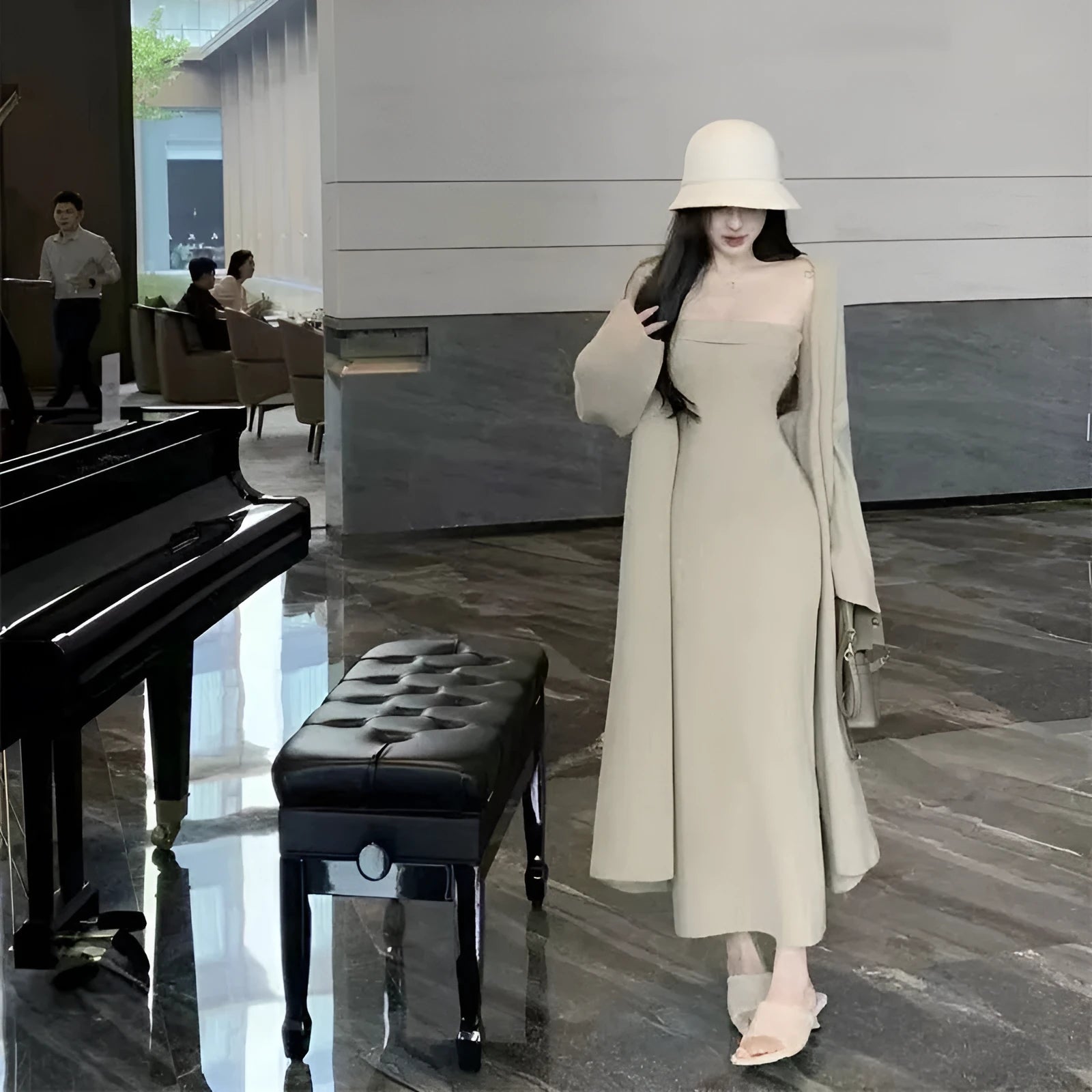 Women's grey knitted cardigan dress sweater suit two piece set with long skirt and regular sleeves.