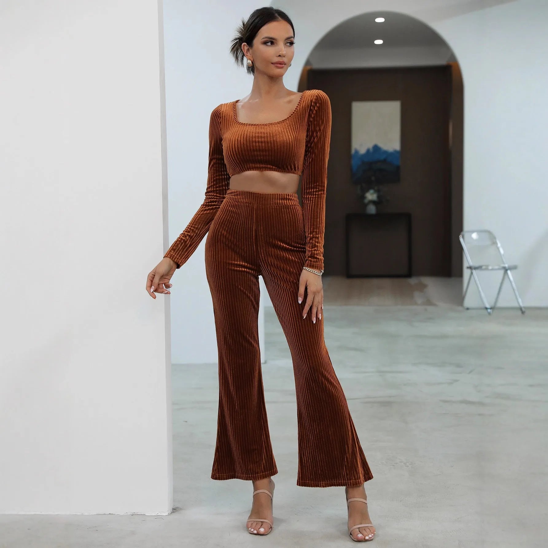 Caramel coloured women's long sleeve sweater and jogger lounge set laid flat.